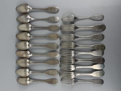 a lot of silver spoons and forks on a table