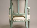 an image of a chair with a white cushion and a blue frame