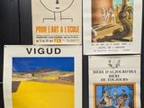 several posters on the wall of a public restroom in france