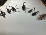 a lot of toy army vehicles on a table