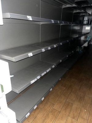 many empty shelves on the floor in a store