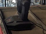 a machine that is moving luggage on a conveyor belt