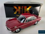 a toy car that is sitting in front of a box