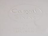a close up of a white plate with a logo on it