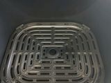 an open oven with a grill inside of it