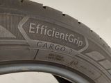 a close up of a tire on a white surface with the word efficient grip written on it