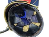 a black purse with a blue bird on top of it
