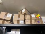 many boxes on a shelf in a room