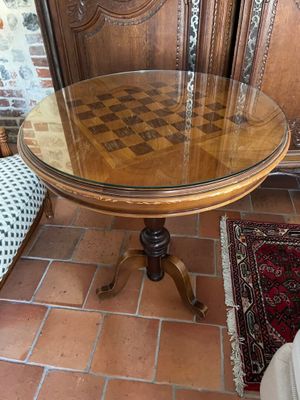 a table with a chess board on it in a room