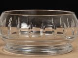 a glass bowl that is sitting on a table