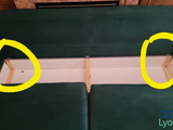 two yellow circles on the back of a green couch