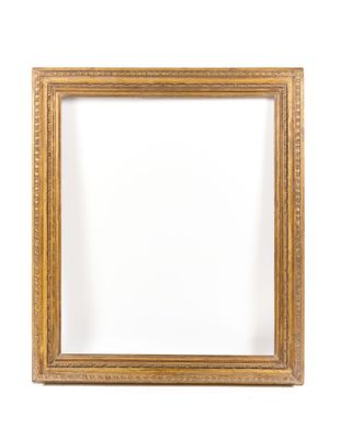 a gold frame on a white wall with a white background