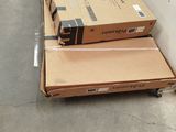 two boxes sitting on top of each other on the floor