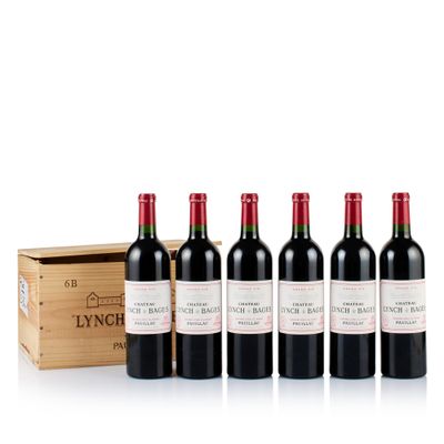 six bottles of red wine in a wooden box