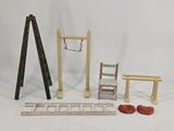 a set of miniature wooden toys including a ladder, ladders, and a bench