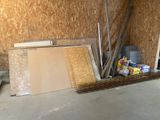 a pile of construction materials sitting on the floor in a room