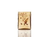 a picture of a gold ring with a dragon on it