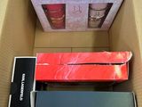 two boxes of electronic devices sitting in a cardboard box