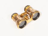 a close up of a pair of binoculars on a white surface