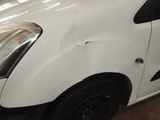 a picture of a white van parked in a garage
