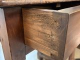 a wooden table with a drawer on top of it