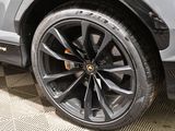 a close up view of a car ' s wheels and tires