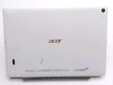 a close up of a laptop computer on a white surface