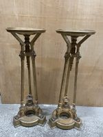 Paire de sellettes en bois doré.