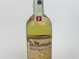 an image of a bottle of alcohol sitting on top of a white surface