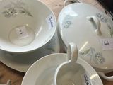 a lot of dishes that are sitting on a table