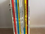 a stack of children ' s books sitting on the floor