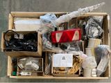 a box full of assorted items sitting on the ground