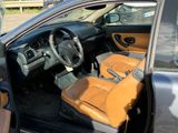 a car that has a brown leather seat in it
