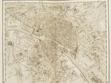une vieille carte de Paris sur laquelle figure un plan de la ville
