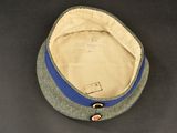 an image of a hat with a button on it