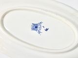 a white plate with a blue and white design on it