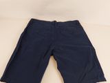 the shorts are dark blue and have buttons on the side