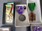several medals and medals are in a box on a table