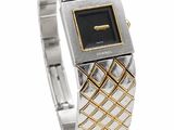 a close up of a wrist watch on a white surface