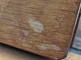 a close up of a wooden box on a table