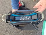 a person that is holding a bag that has a lock on it