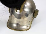 a silver helmet with a black hat on top of it