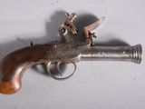 an old gun that is sitting on a table