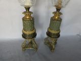 pair of antique brass and green glass lamps on pedestals