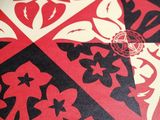 red, black, and white pattern with a pentagram on it