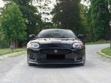a black sports car parked on the side of the road