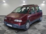 a red van that is parked on a checkered floor