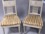 pair of antique chairs with upholstered upholstered seats