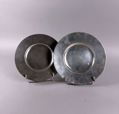 pair of silver plate on stand on white background