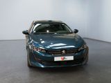 a blue car that is parked in a room